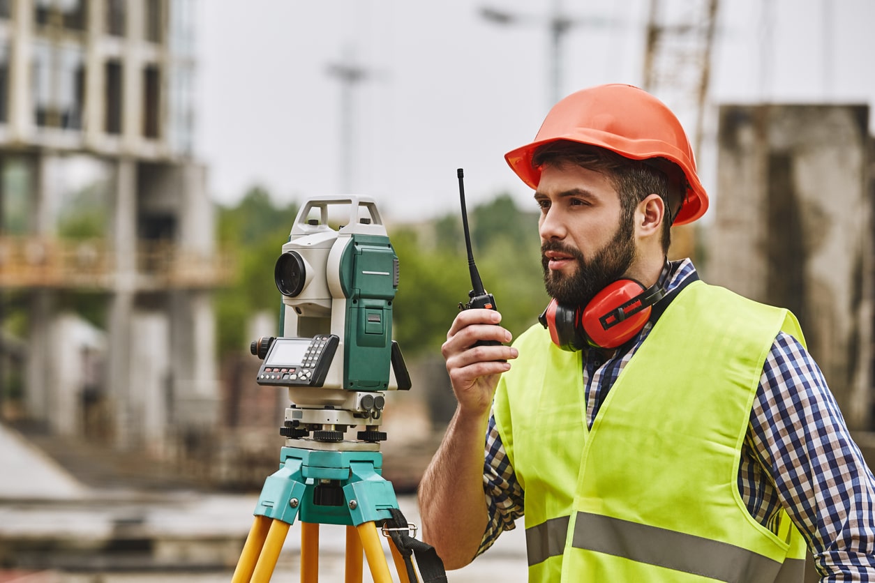 Los Angeles construction contractor giving orders with walkie talkie.