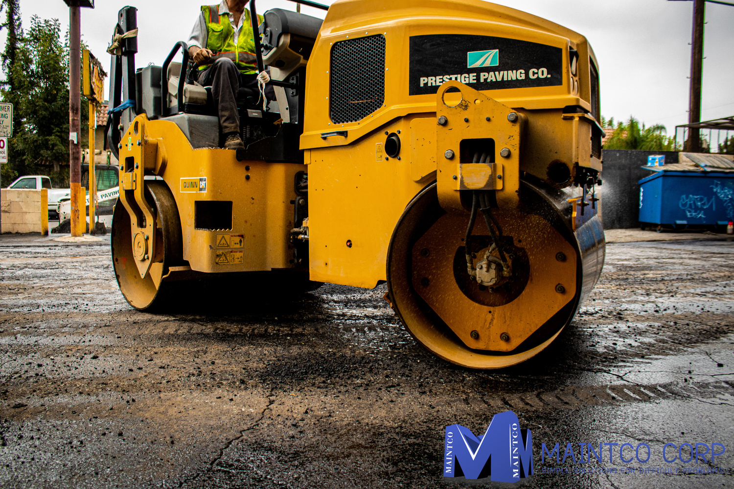 Maintco employee using a Prestige Paving Co paver