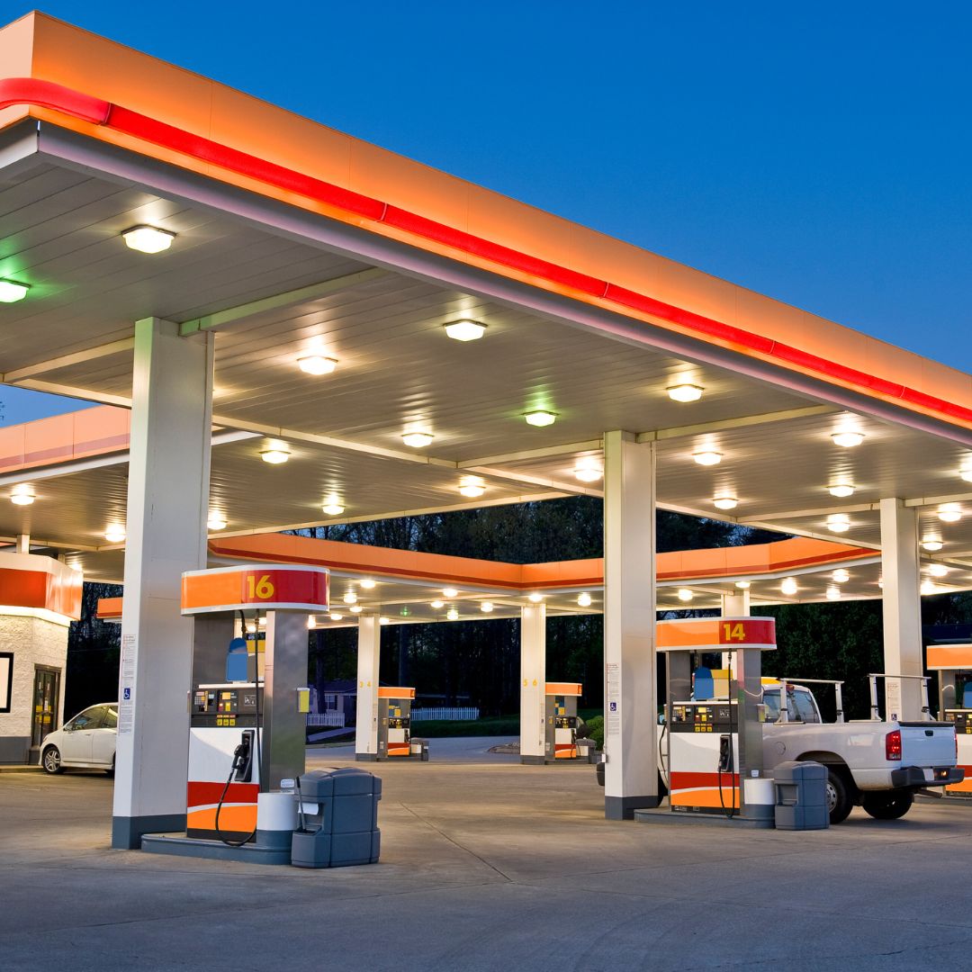 A remodeled gas station with a modern design and vibrant colors. The station features newly installed fuel pumps, a sleek canopy, and a well-organized convenience store. The remodel showcases updated signage, enhanced lighting, and a fresh, inviting appearance.