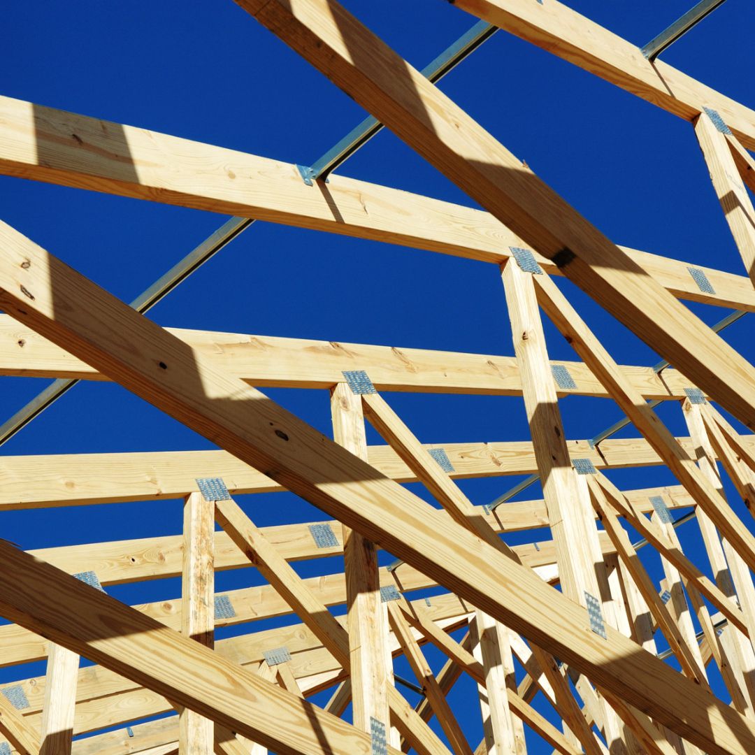 "Image of a commercial carpenter working on a construction project, using tools and equipment to perform carpentry tasks.